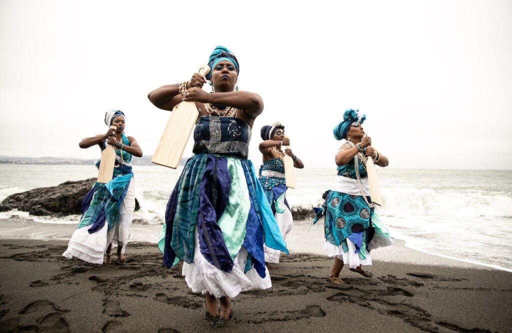 Women dancing on the beach